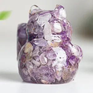 Fortune cat figurine crafted from purple amethyst crystals and clear resin on a grey base