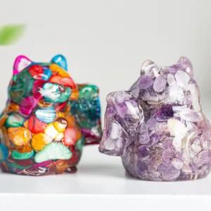 Detailed macro shot of natural crystal resin cats with colorful stone fillings