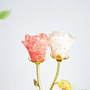 Detail of pink and white crystal rose ornaments with golden metallic stems and leaves