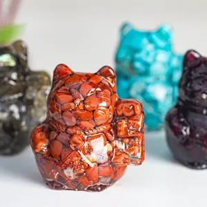 Detailed macro view of colorful natural crystal stone resin Maneki-neko lucky cat statues