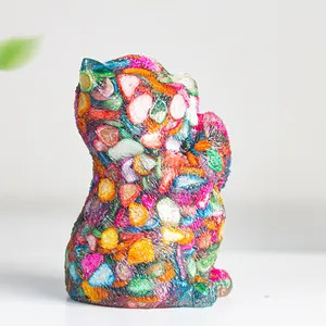 Close-up of colorful crystal cat ornament with intricate resin textures and vibrant hues