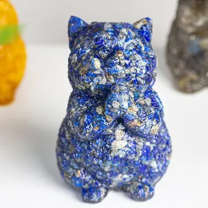 Lapis lazuli cat figurine handcrafted from blue crystal stone in a praying pose