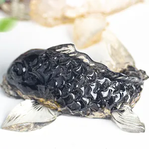 Macro detail of koi fish figurine with black resin and gold glitter interior