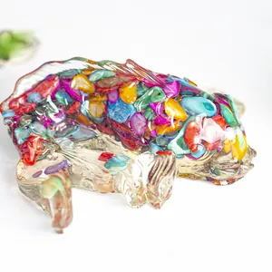 Macro detail of koi fish figurine featuring colorful natural crystal stone inlay