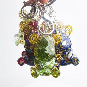 Handmade bear keychain with natural crystal gravel, gold leaf, and resin finish