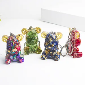 Resin bear keychains with natural crystal stones and gold foil in steampunk style
