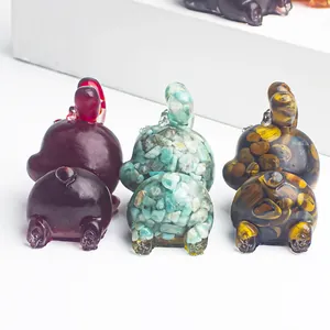 Natural crystal resin bunny figurine set featuring amethyst and tiger eye stone styles