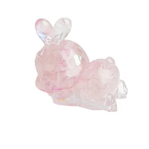 Iridescent pink crystal bunny resin ornament with heart detail on white background