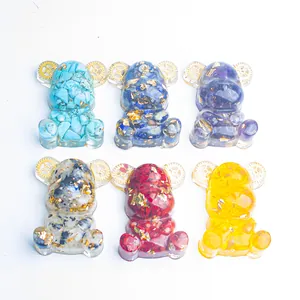 Orgonite resin bear figurine set with natural crystals, gold foil, and metal gears
