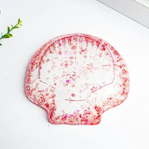 Scallop shell jewelry tray made of resin with pink crystals and sequins for decor