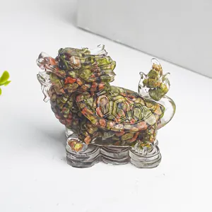 Detailed macro view of crystal dragon turtle resin craft with colorful stone inlay