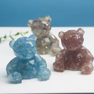 Trois figurines d'ours en cristal facetté avec pierres naturelles et feuilles d'or