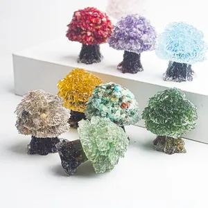 Detailed view of colorful natural crystal stone trees on tiered display stand