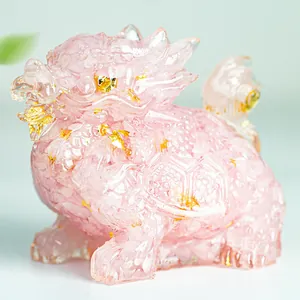 Detailed view of a pink resin dragon turtle statue with embedded gold foil flakes