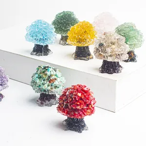 Detailed view of colorful natural crystal stone trees on tiered stands for home decor