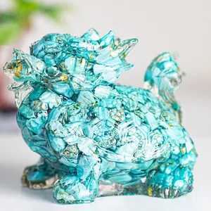 Detail of turquoise crystal resin dragon turtle statue with gold leaf flakes accents