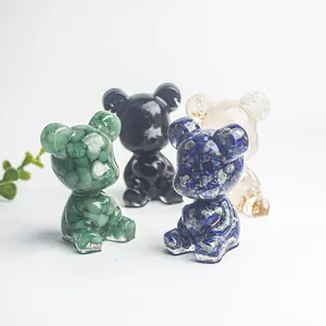 Détail de quatre ours en cristal avec améthyste, pierres vertes et feuilles d'or