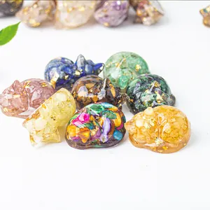 Sleeping cat crystal figurine with natural gemstones and gold foil in resin