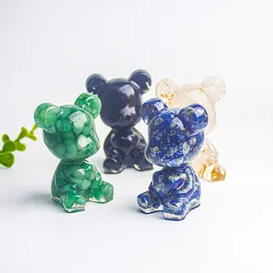Quatre figurines d'ours en résine de cristal avec pierres et feuilles d'or