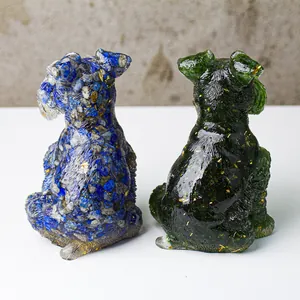 Detail of Schnauzer crystal statues featuring inlaid natural stones and gold leaf accents