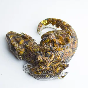 Artistic sleeping dragon figurine crafted in resin with natural amber crystal stones