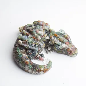 Artistic sleeping dragon figurine made of resin with natural crystals and sea shells
