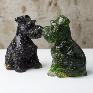 Detailed pair of Schnauzer dog figurines with gold foil accents in black and dark green