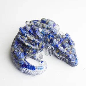 Top view of sleeping dragon figurine made of resin with lapis lazuli crystal stones