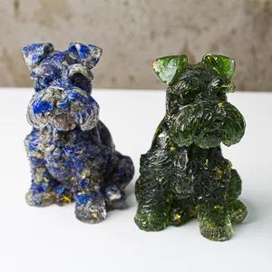 Detailed view of blue and green resin schnauzer statues with gold foil crystal texture