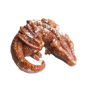 Sleeping dragon resin ornament with reddish-brown scales and natural crystal stone details