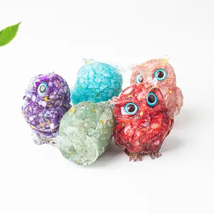 Handcrafted owl figurines set with natural crystal stones, resin, and gold foil accents
