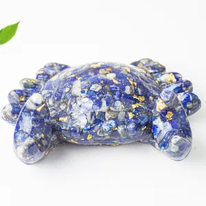 Macro top view of a resin crab figure made with lapis lazuli and gold leaf detail