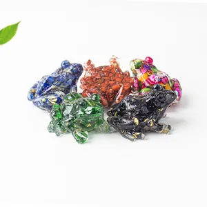 Close-up of five colorful crystal resin frog figurines for desk or fish tank decor