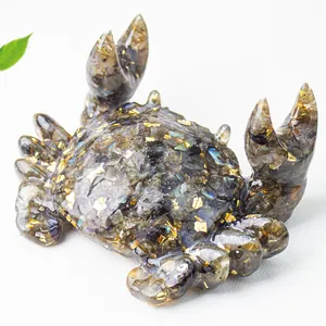 Detail of crystal resin crab stand featuring blue labradorite chips and gold foil flakes