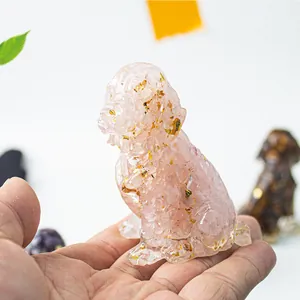 Macro detail of poodle figurine made with pink natural crystal stones and gold foil