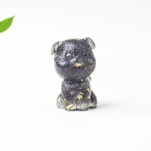 Detailed view of Schnauzer dog resin figurine with gold leaf and textured fur carving