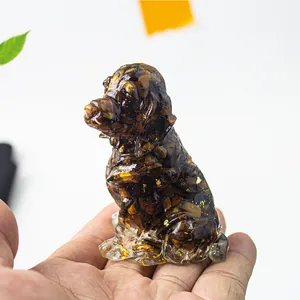 Detail of a handmade resin dog figurine filled with natural brown tiger eye crystal stones