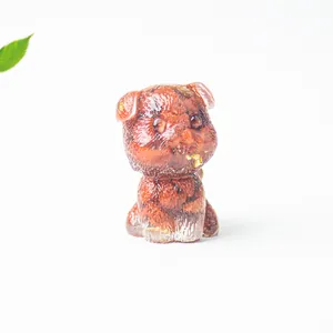 Detailed close-up of a resin schnauzer dog figurine with crystal stones and gold foil