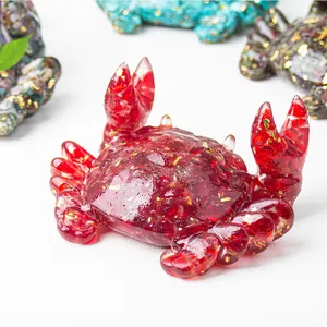 Detailed macro of a red resin crab figurine with gold leaf foil interior decoration