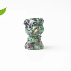 Macro shot of Schnauzer statue made of natural green and black crystal stones resin