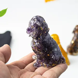 Close-up of a purple crystal resin golden retriever dog statue with gold foil accents