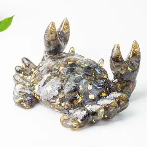 Macro detail of resin crab holder with natural crystal stones and gold foil flakes