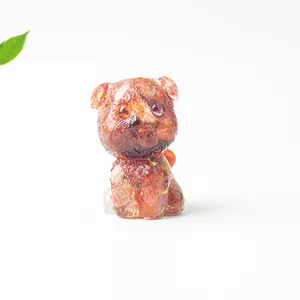 Macro shot of a red crystal schnauzer figurine with decorative gold foil flakes inside