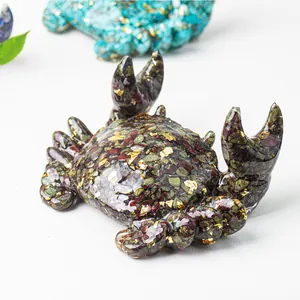 Handmade resin crab phone stand with natural crystal stones and gold foil details