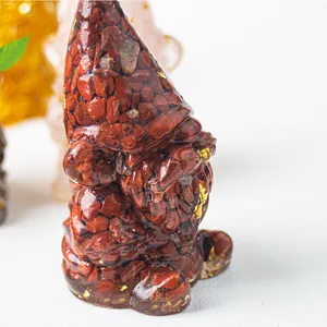 Handmade resin gnome figurine with red jasper stones and gold leaf foil accents