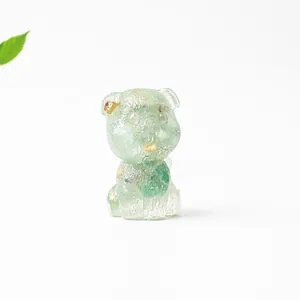 Macro shot of Schnauzer crystal resin decor with gold flakes and a green leaf background