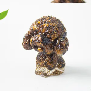 Detail of crystal resin teddy dog figurine with gold leaf inlay and textured fur