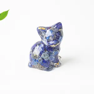 Detailed macro view of handmade blue lapis lazuli resin cat figurine with gold leaf