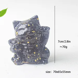 Detail view of a black resin lucky cat statue with gold foil, 70x65x55mm dimensions