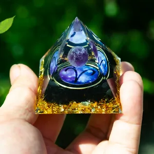 Orgone Aries pyramid with amethyst sphere, obsidian chips and gold foil in resin